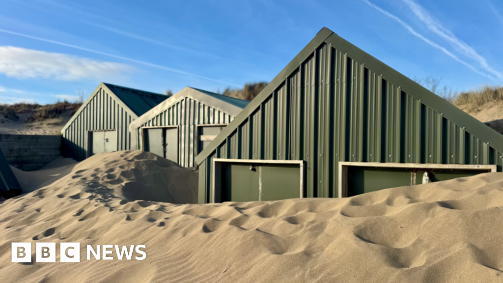 Beach huts worth £250k get buried in sand